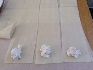 Put 2 tsp of feta on each strip of phyllo dough