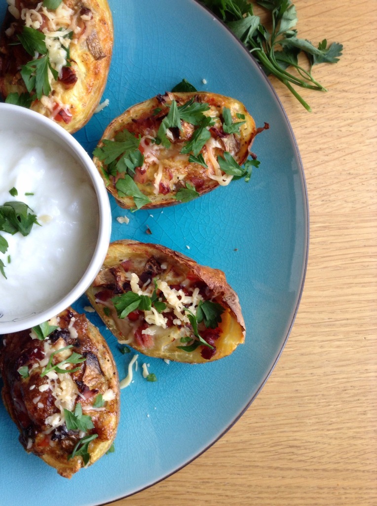 Easy baked breakfast potato skins. Full of protein from the eggs. Also with onions, peppers and mushrooms and bacon