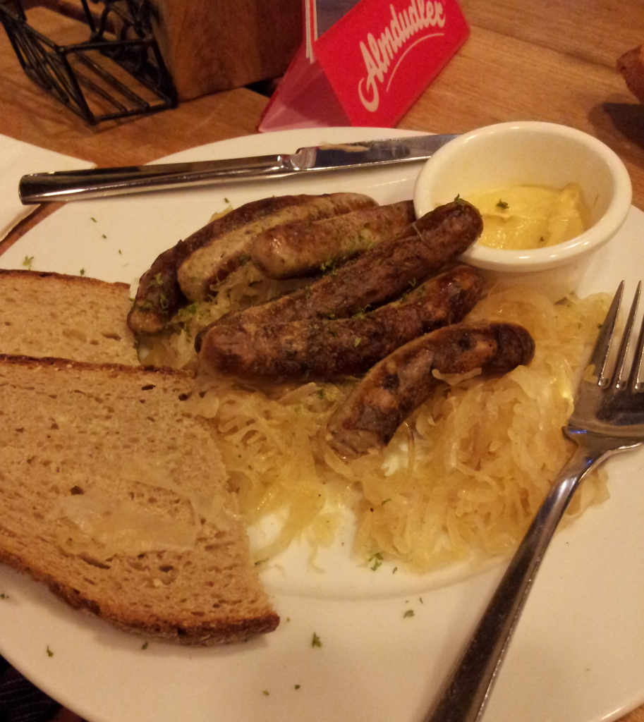 Sauerkraut, sausage and rye bread with mustard